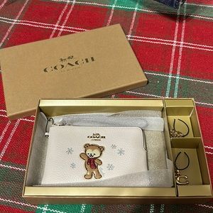 Coach snowflake Christmas wrislet with charms